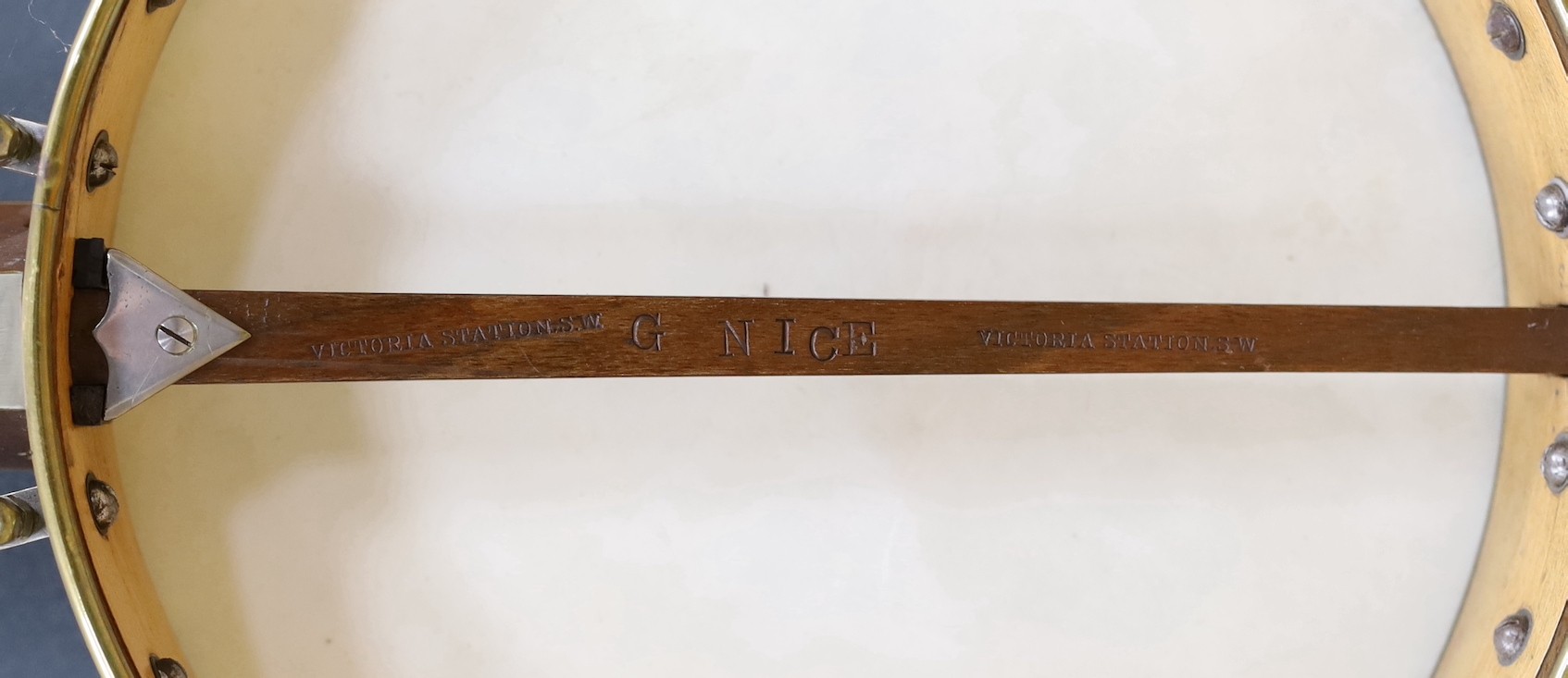 A cased Reliance banjo, 88cms long